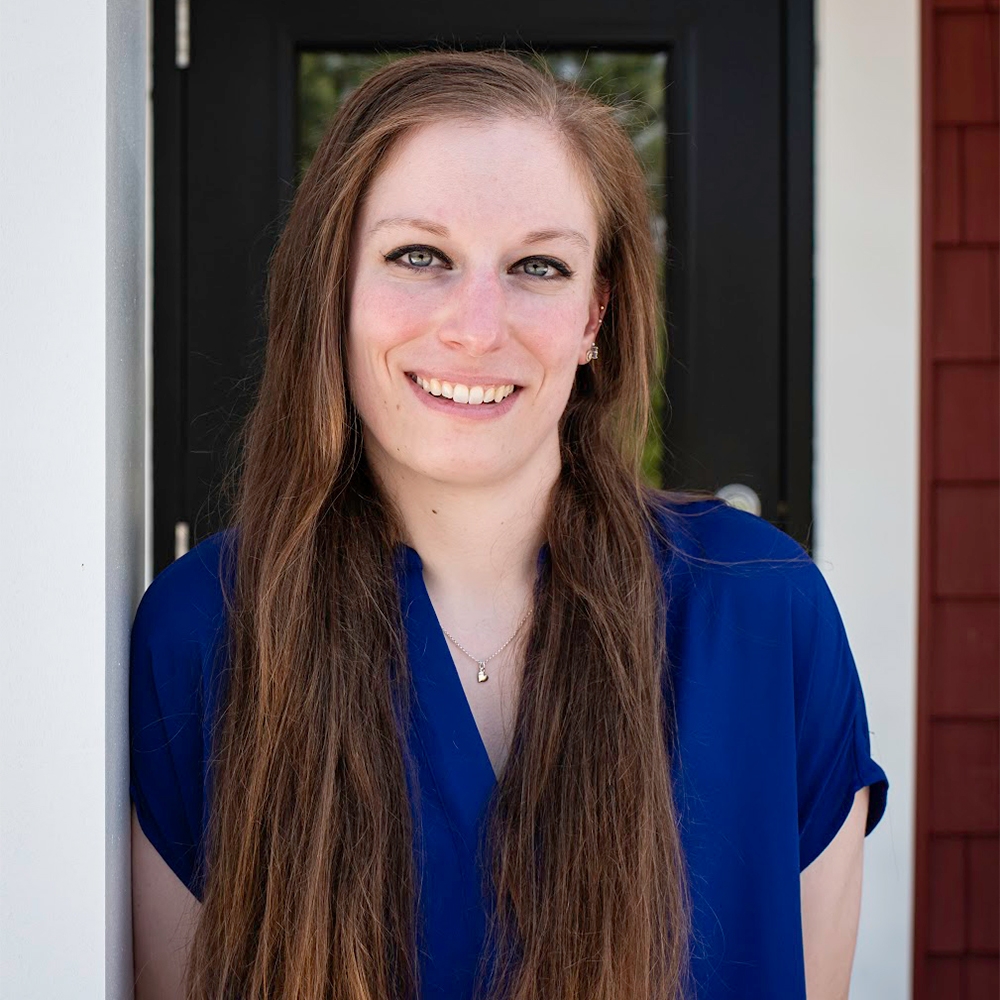 woman in a blue blouse smiling