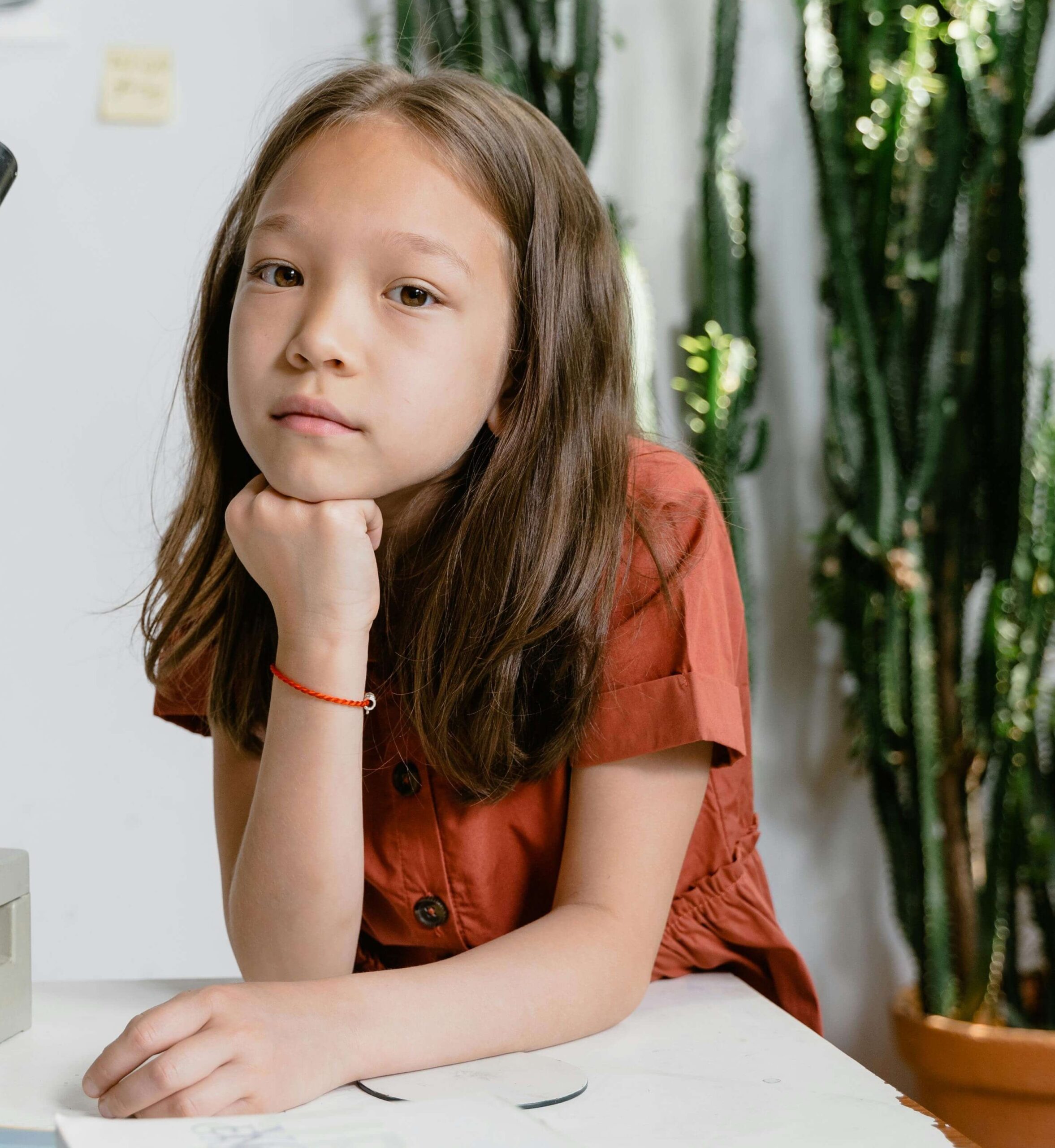 Thoughtful young girl leaning on a desk. With the help of a compassionate child therapist in South Jersey, you can help your child find the support they need to manage their anxiety, depression, behavior, and more.