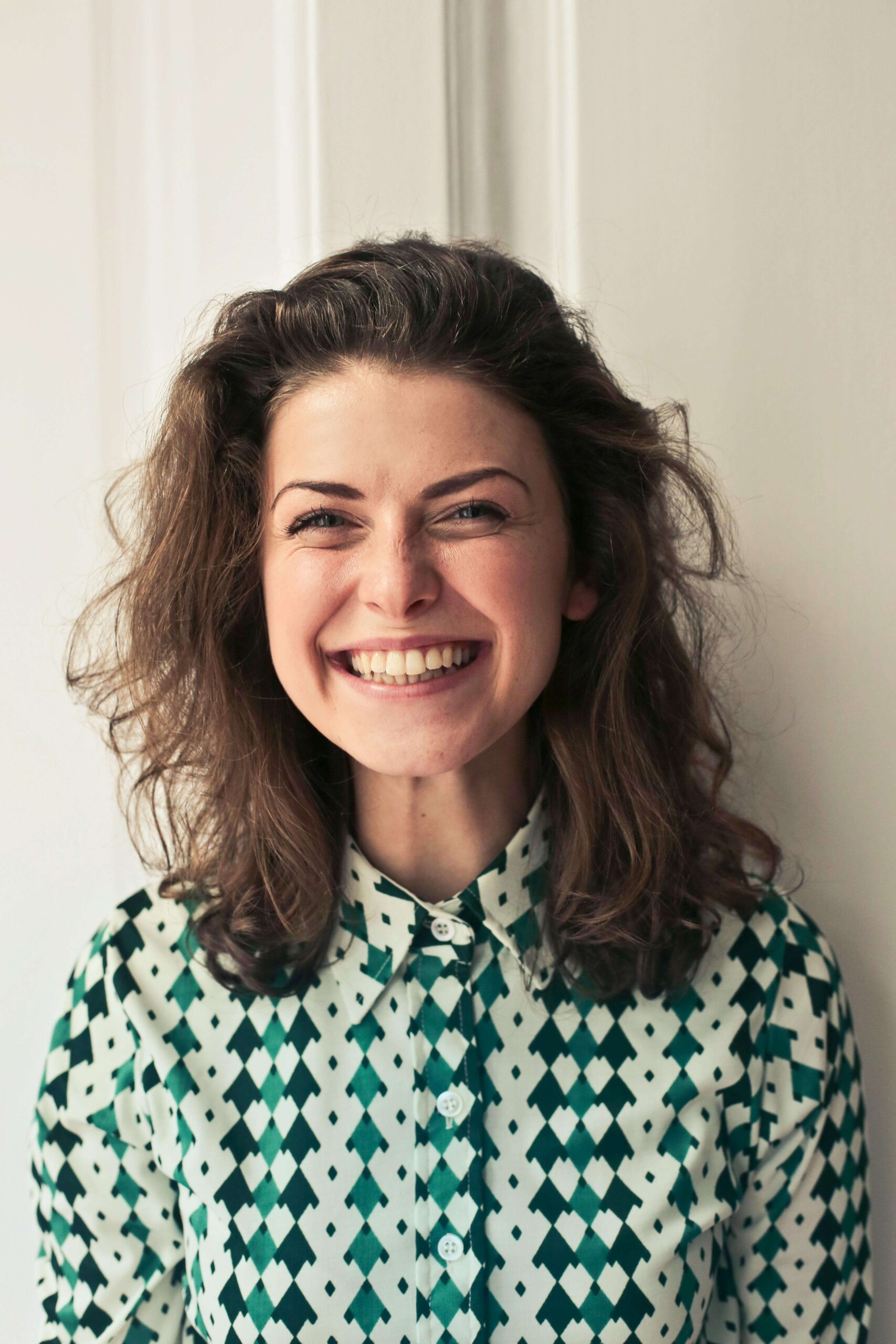 Happy woman smiling. Find clarity and support navigating your life as a neurodivergent individual with the help of Autism testing in South Jersey.