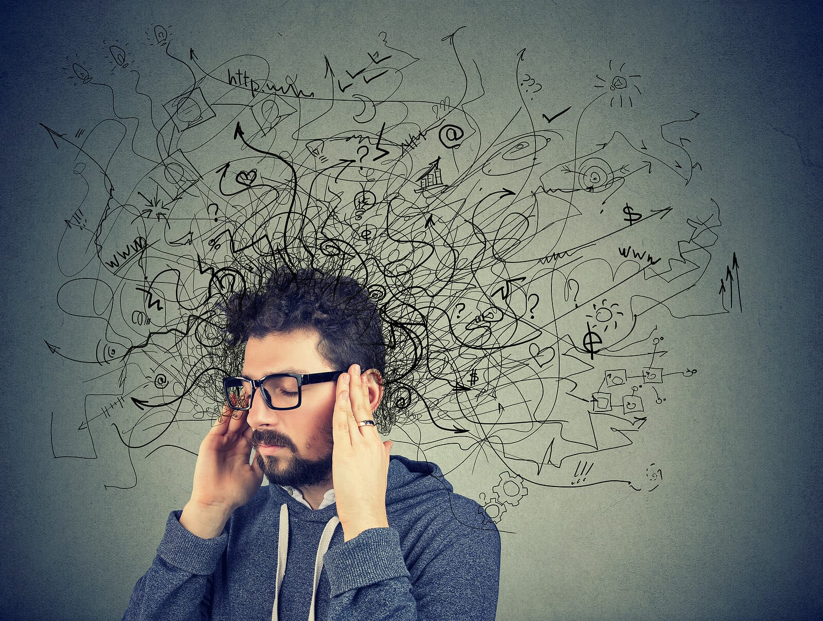 Stressed man holding his head with chaotic scribbles around him. Gain clarity and focus with ADHD assessments and ADHD testing in South Jersey.