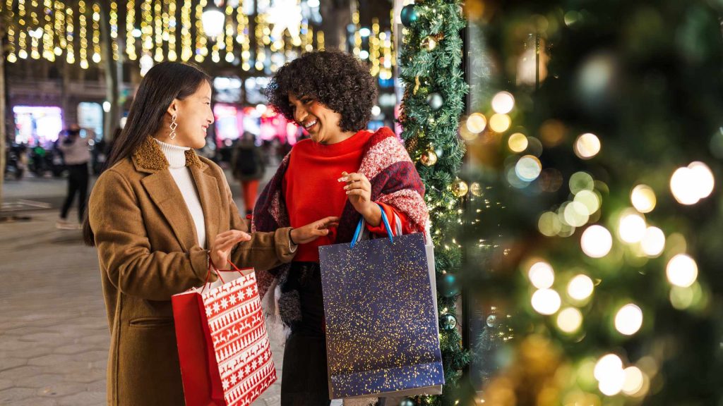 Friends doing holiday shopping in New Jersey. Journaling and writing lists ahead of time for coping ahead DBT skill. Handling family stress over the holidays is possible with help from a skilled New Jersey therapist.