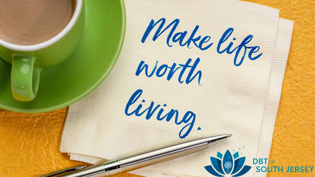 Coffee cup with a napkin that says "Make Life Worth Living" from a DBT therapist in New Jersey. The best therapy in South Jersey is available right here.